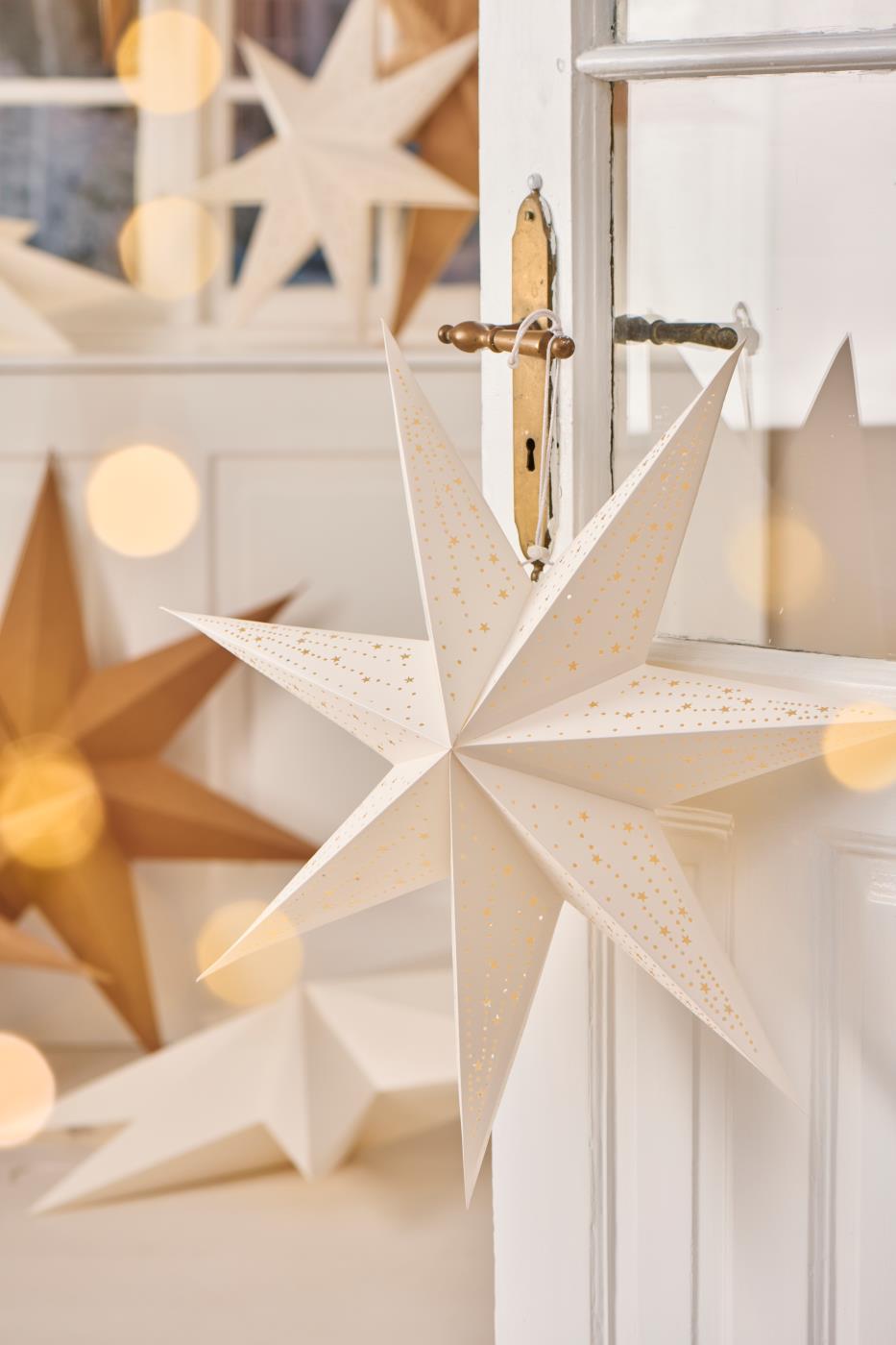 Hvid Stella stjerne fra Ib Laursen hængende på dørhåndtag