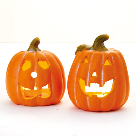 To halloweengresskar i keramikk til telys