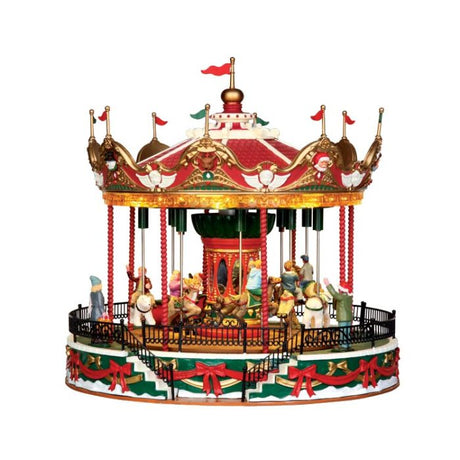 Santa Carousel Julekarrusel med børn, der kører rundt i karrusellen mens forældre ser på fra Lemax. 