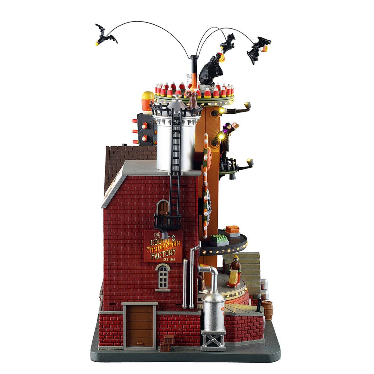 The Count's Candy Corn Factory med lys til Halloween by fra Spooky Town Lemax ser fra siden med produktion