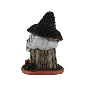 Witch's Skull Hut bygning med lys til Halloween dekoration fra Lemax set fra bagsiden af