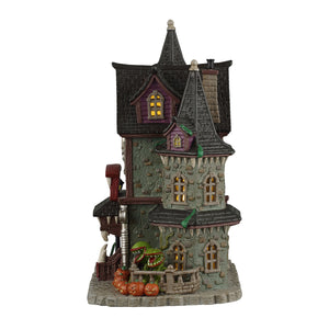 Frightful Fangs Dentistry hus i porcelæn med lys til Halloween dekoration set fra siden med kødædende planter