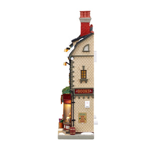 The Christmas Shoppe med lys til juleby fra Lemax set fra siden med bogskilt
